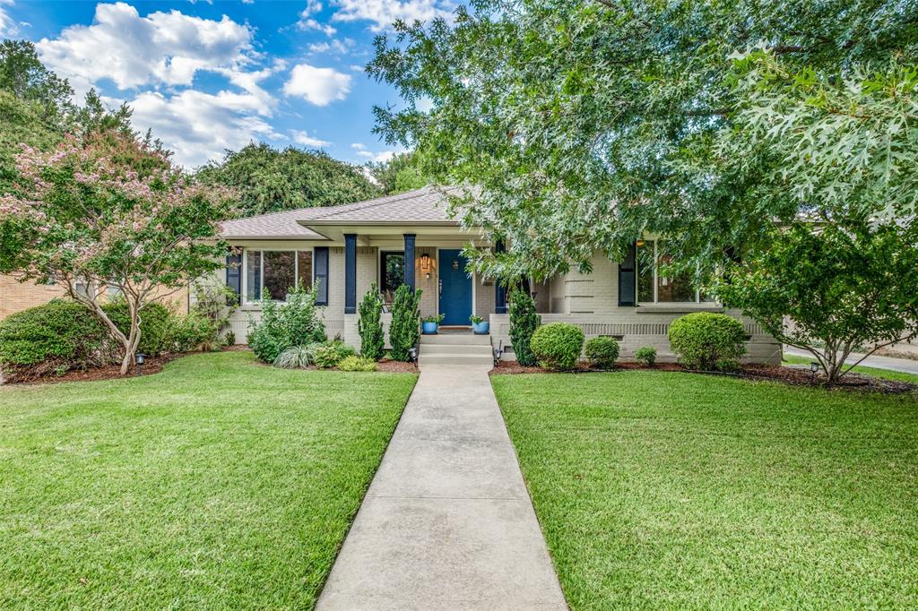 a front view of a house with yard