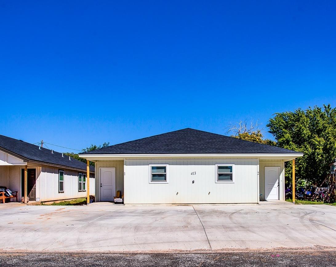 a front view of a house with a garage