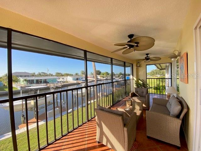 a view of a living room and balcony