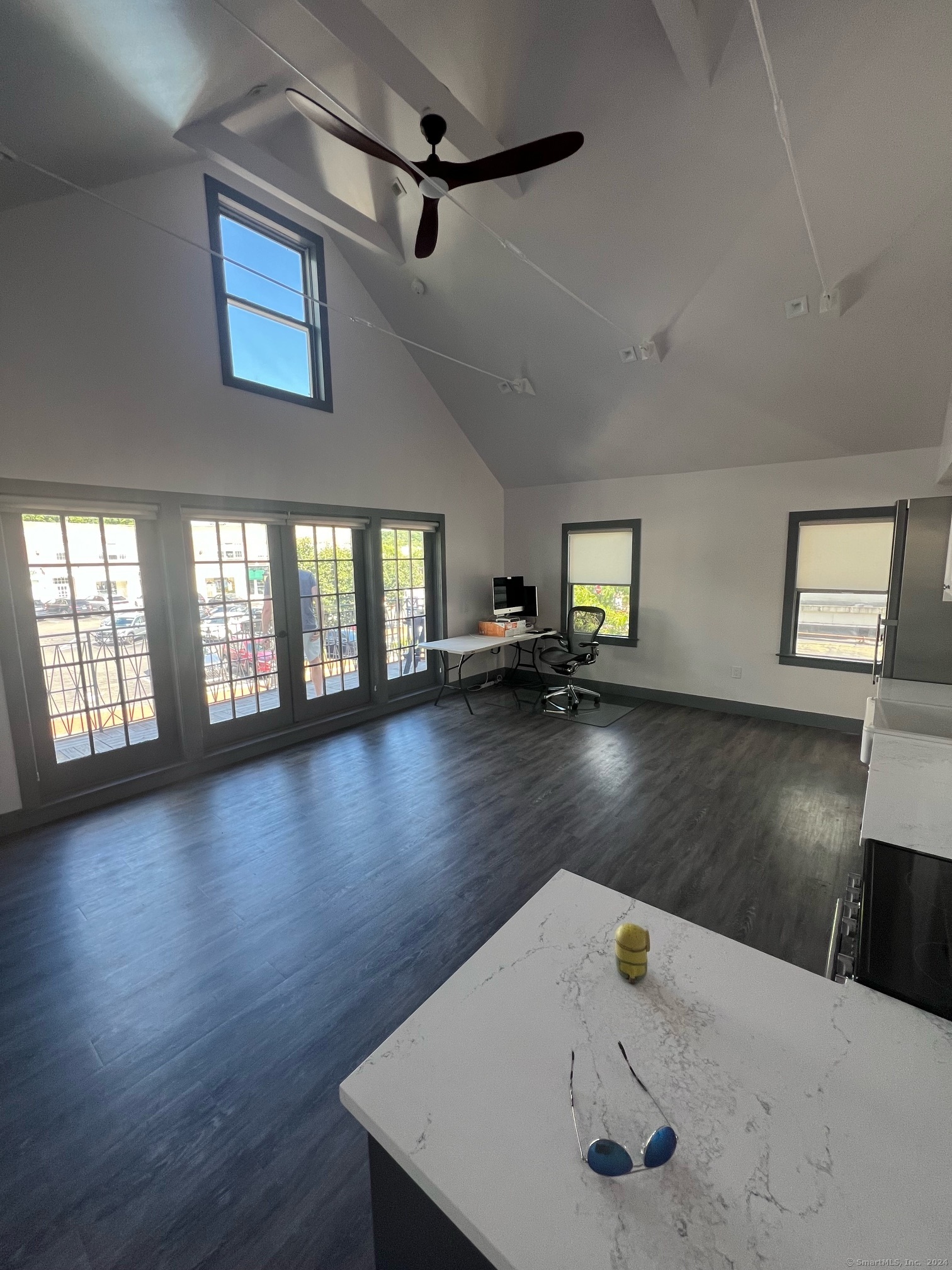 a view of a livingroom with wooden floor