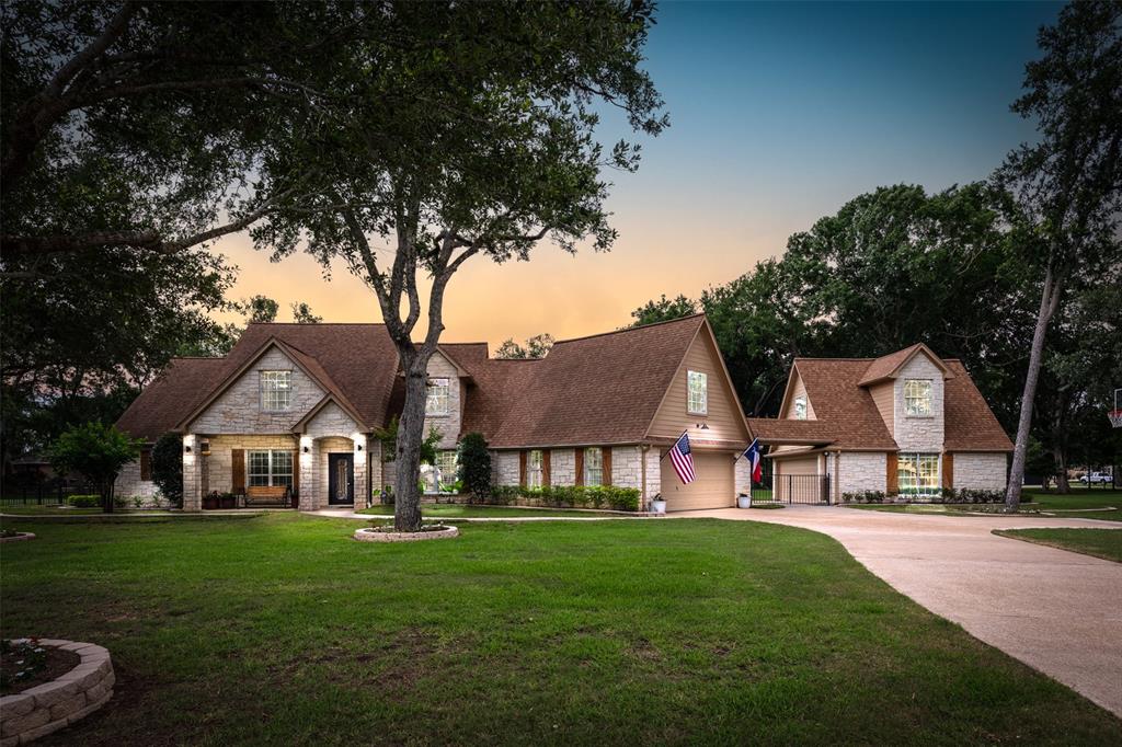 a view of house that has a yard