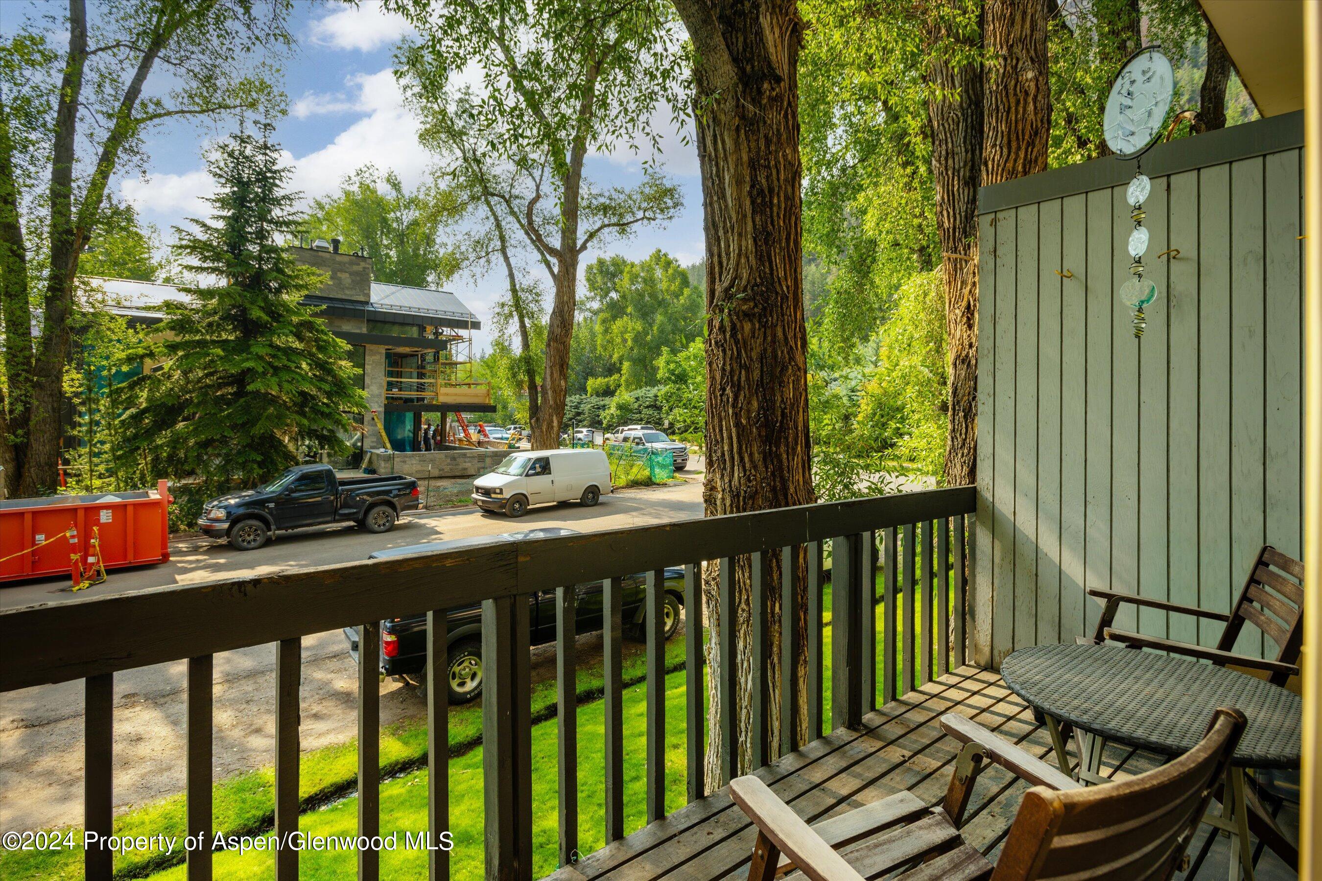 a view of a chairs and table in patio