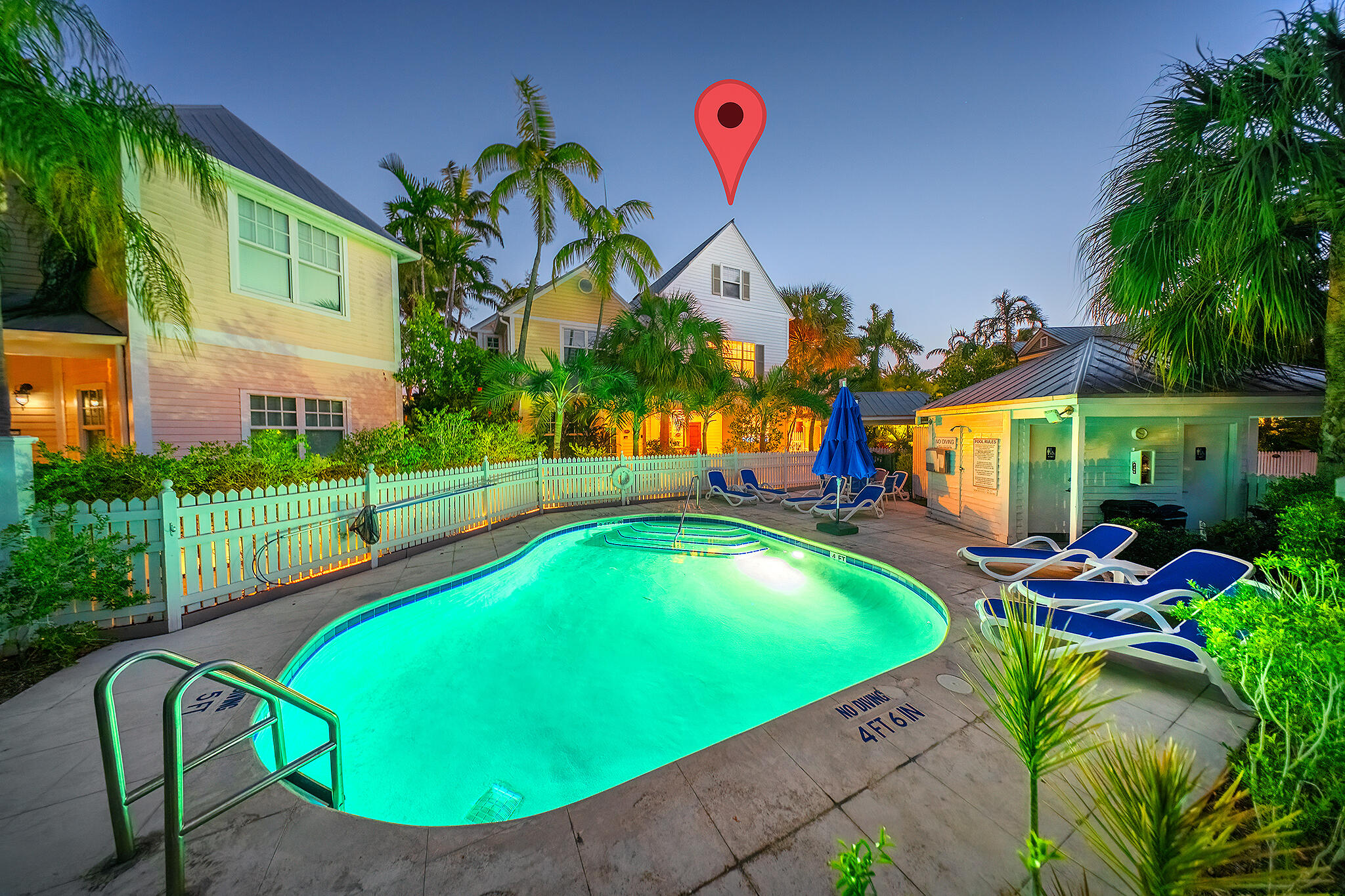 an aerial view of a house with swimming pool garden and patio