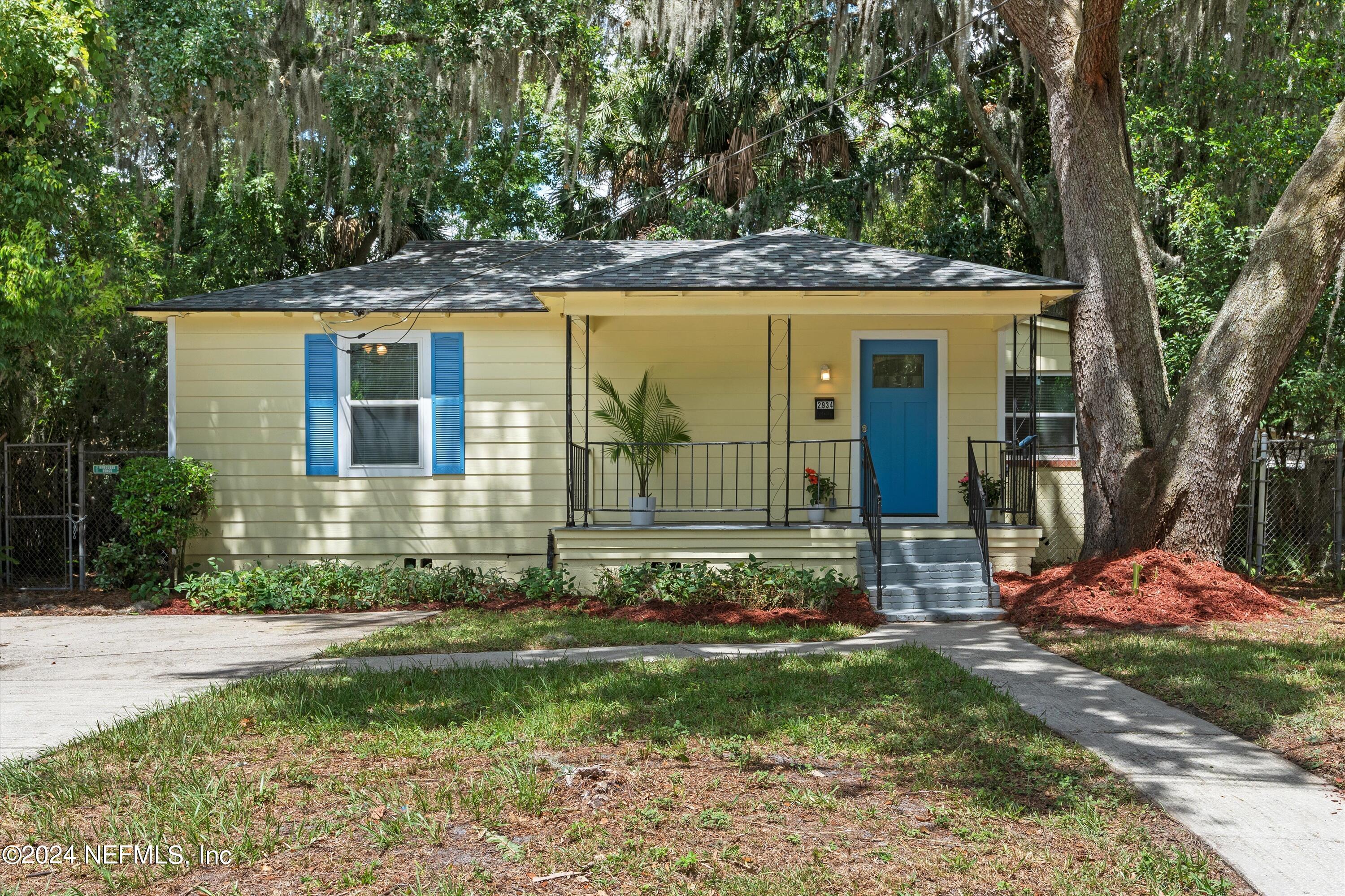 front view of a house with a yard