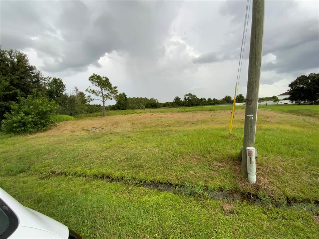 a view of a lake with a big yard