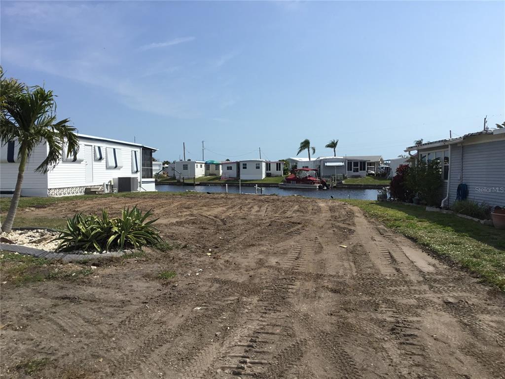 a view of a yard with car parked