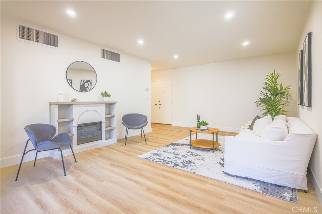 a living room with furniture and a chair