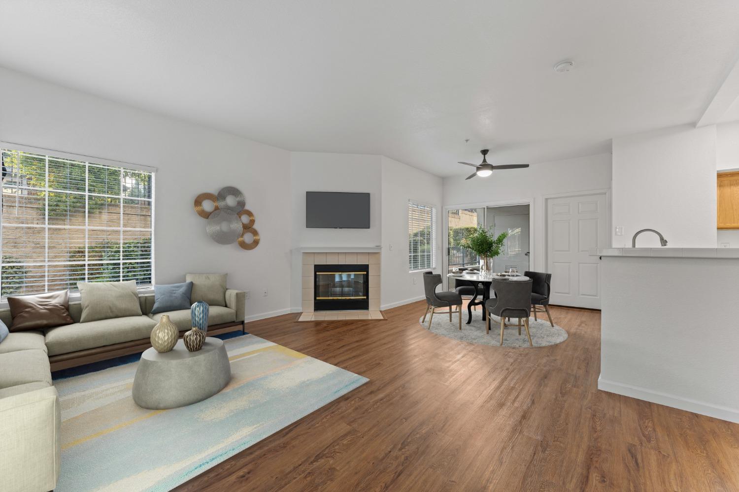 a living room with furniture fireplace and window