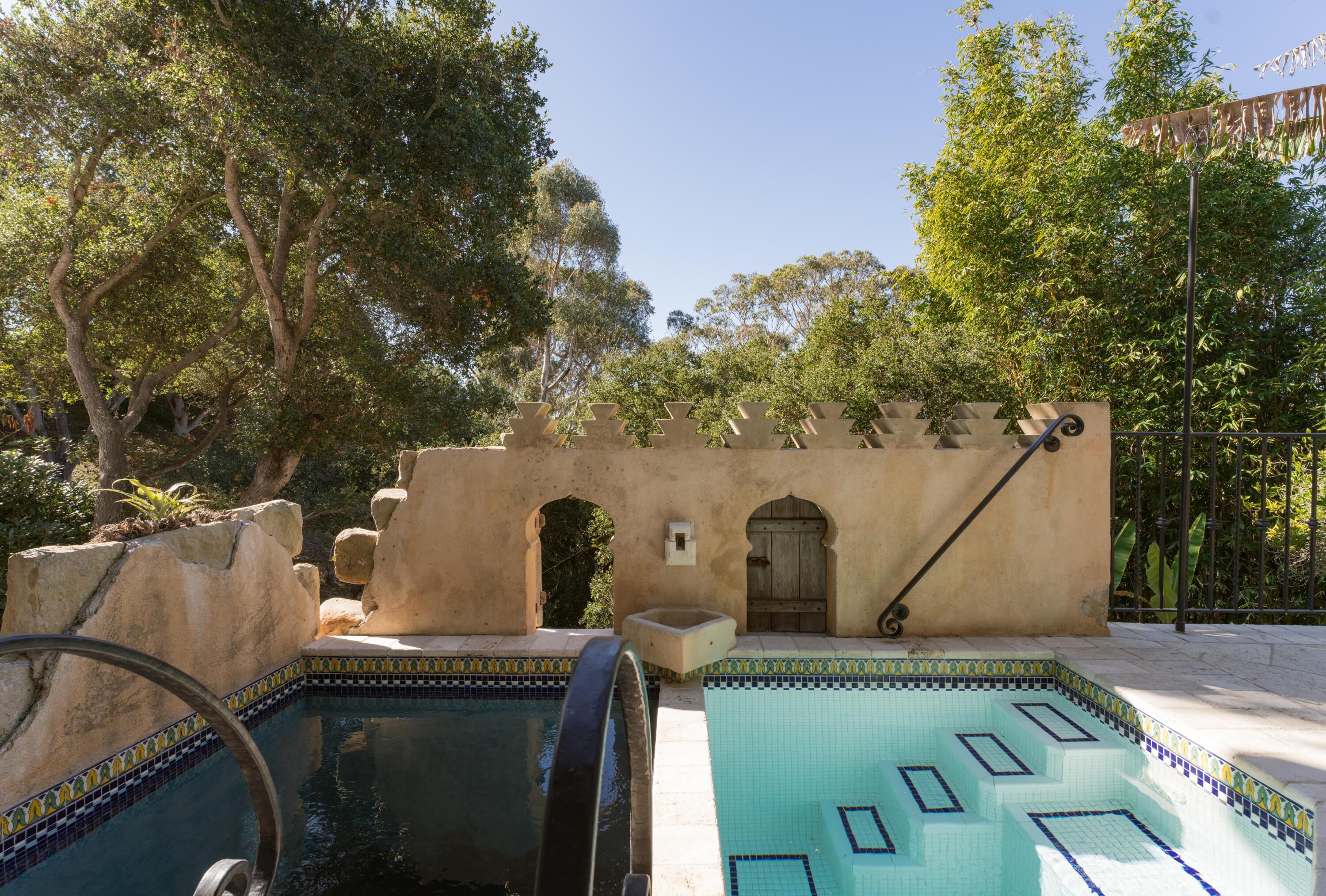 a view of a patio with table and chairs and a fire pit