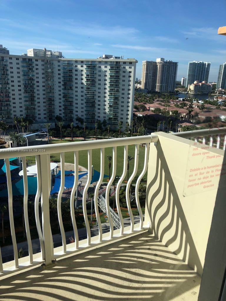 a view of a balcony with chairs