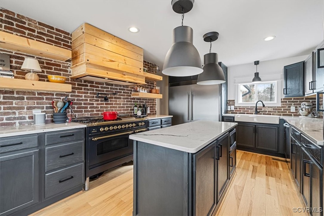 a kitchen with stainless steel appliances a sink and a stove