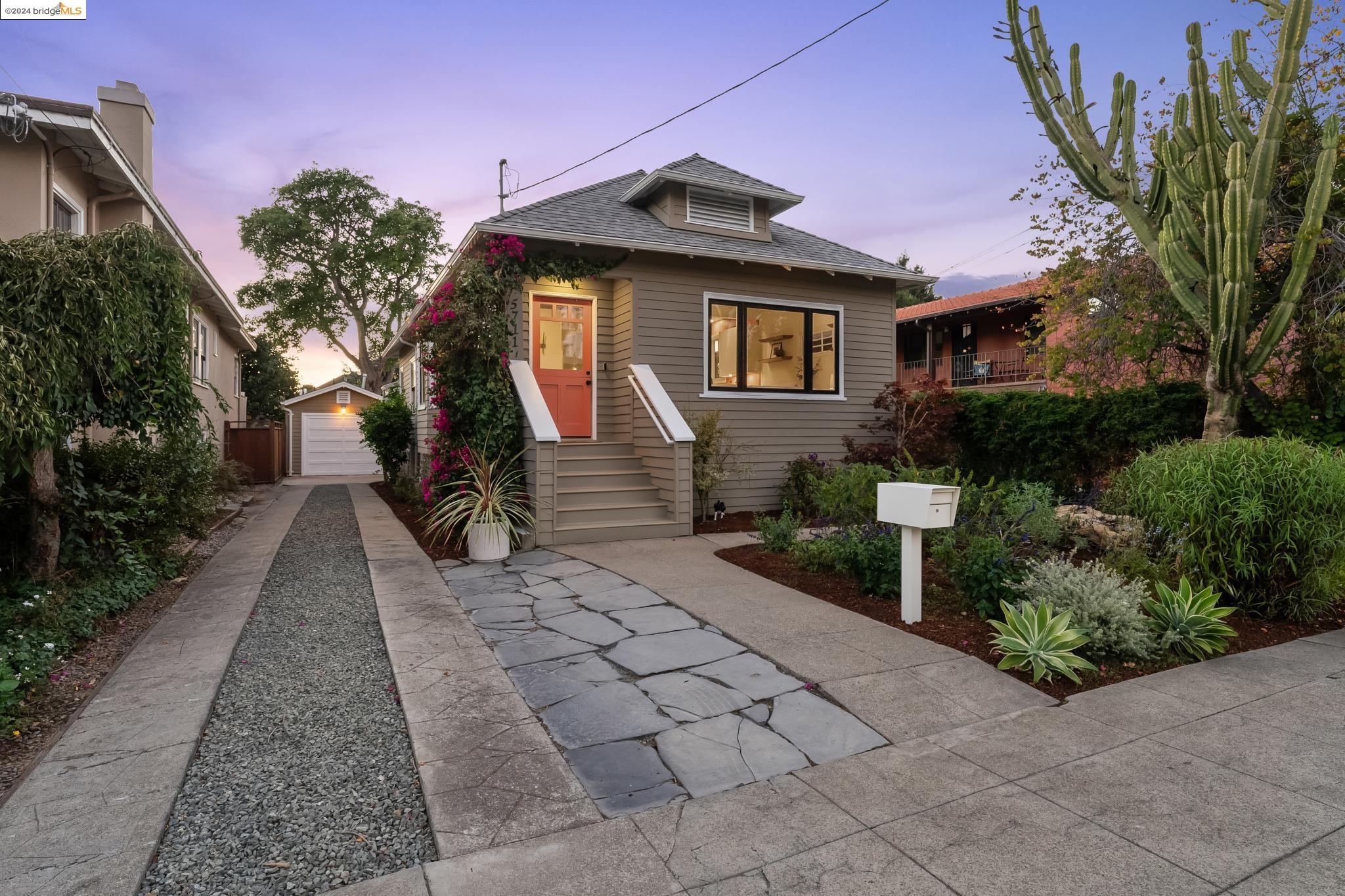 a front view of a house with garden