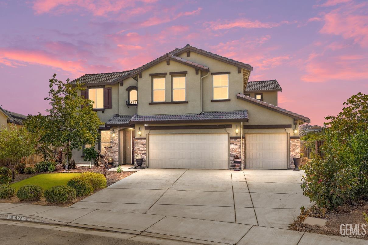 a front view of a house with garage