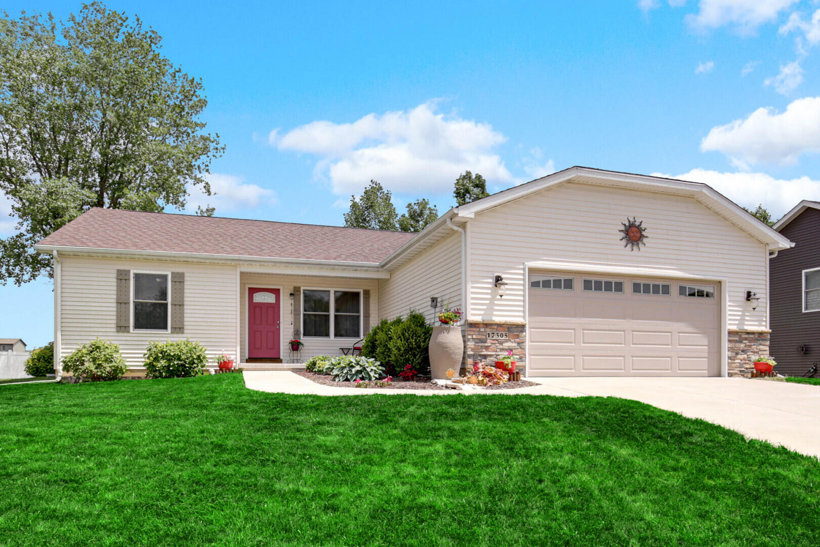 a front view of house with yard and outdoor seating