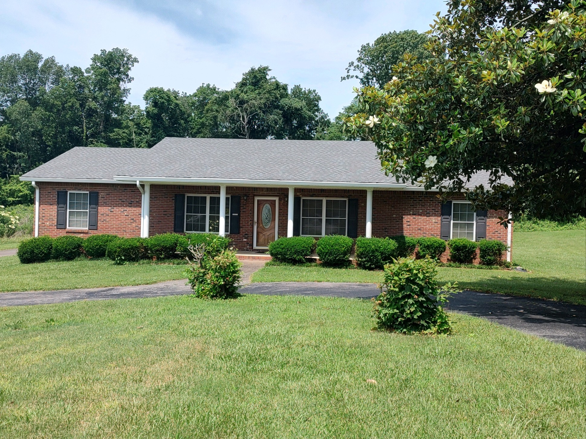 a front view of a house with a yard