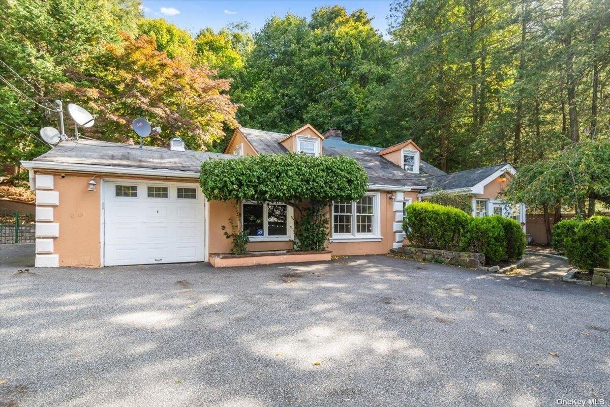 a front view of a house with a garage