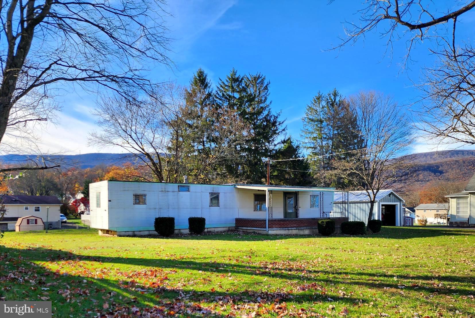 a view of a house with a big yard