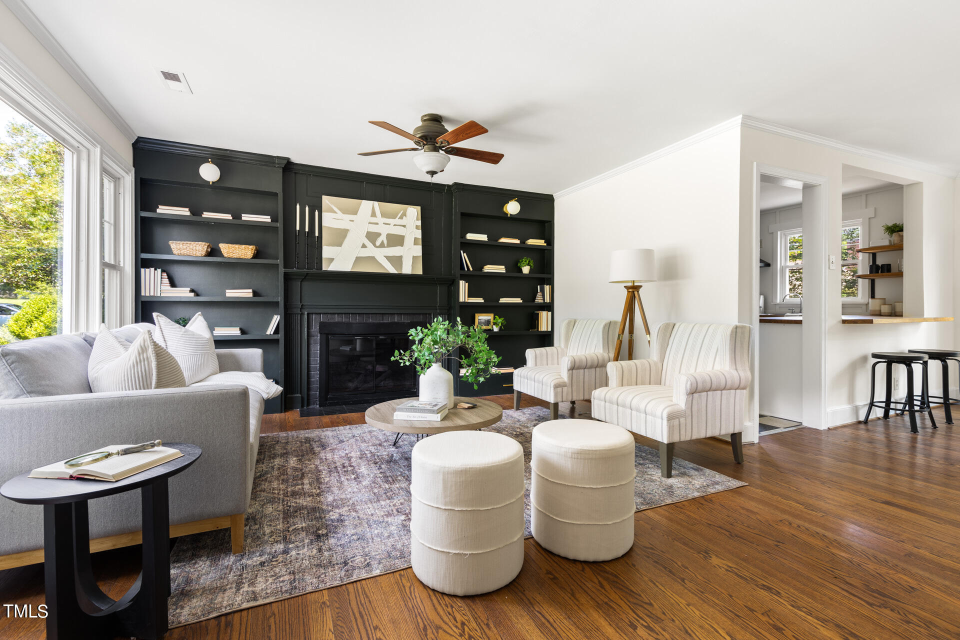 a living room with fireplace furniture and a flat screen tv