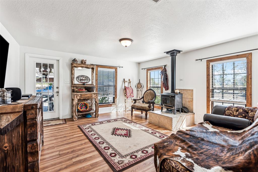 a living room with furniture a rug and a flat screen tv