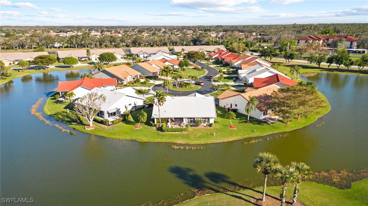 an aerial view of a house with a lake view