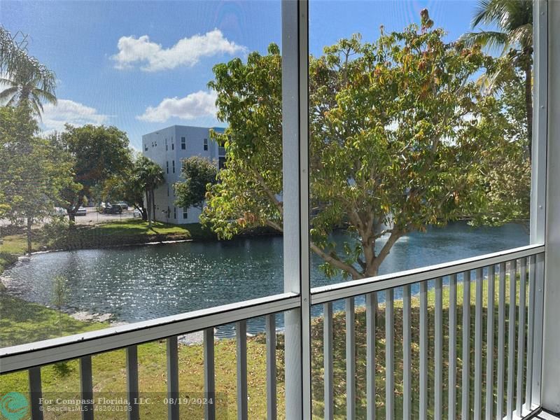 a view of a lake from a balcony