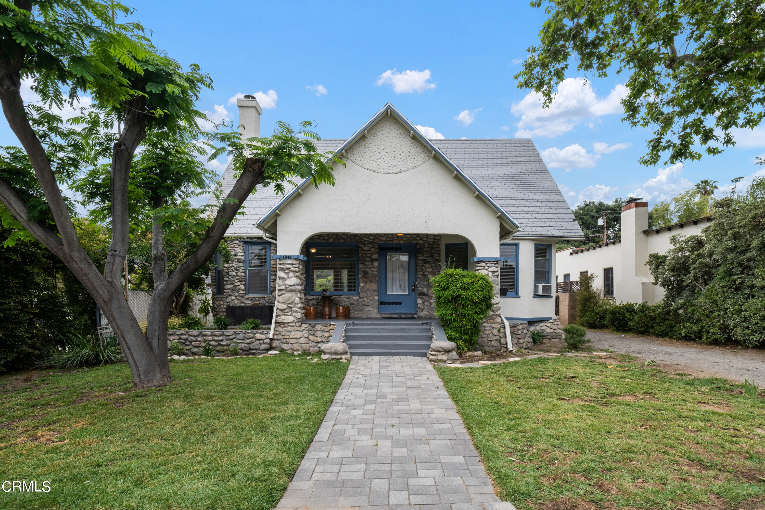 a front view of a house with garden