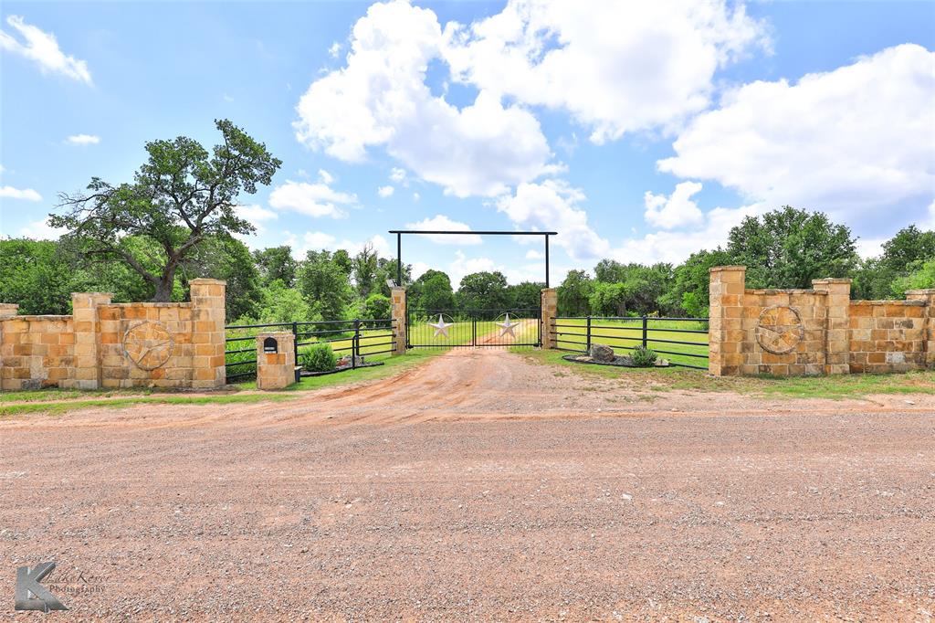 a view of a road with a big yard