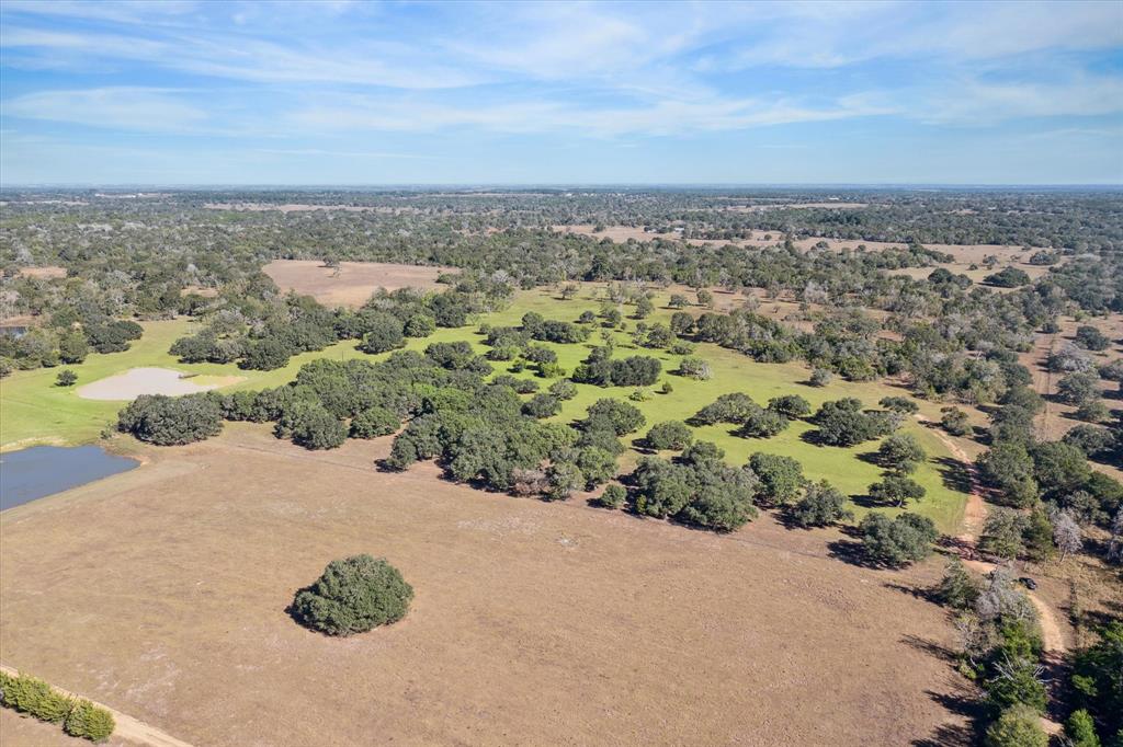 an aerial view of a house with a garden