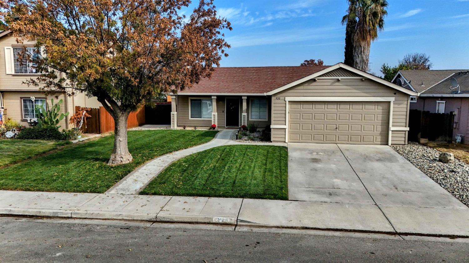 front view of a house with a yard