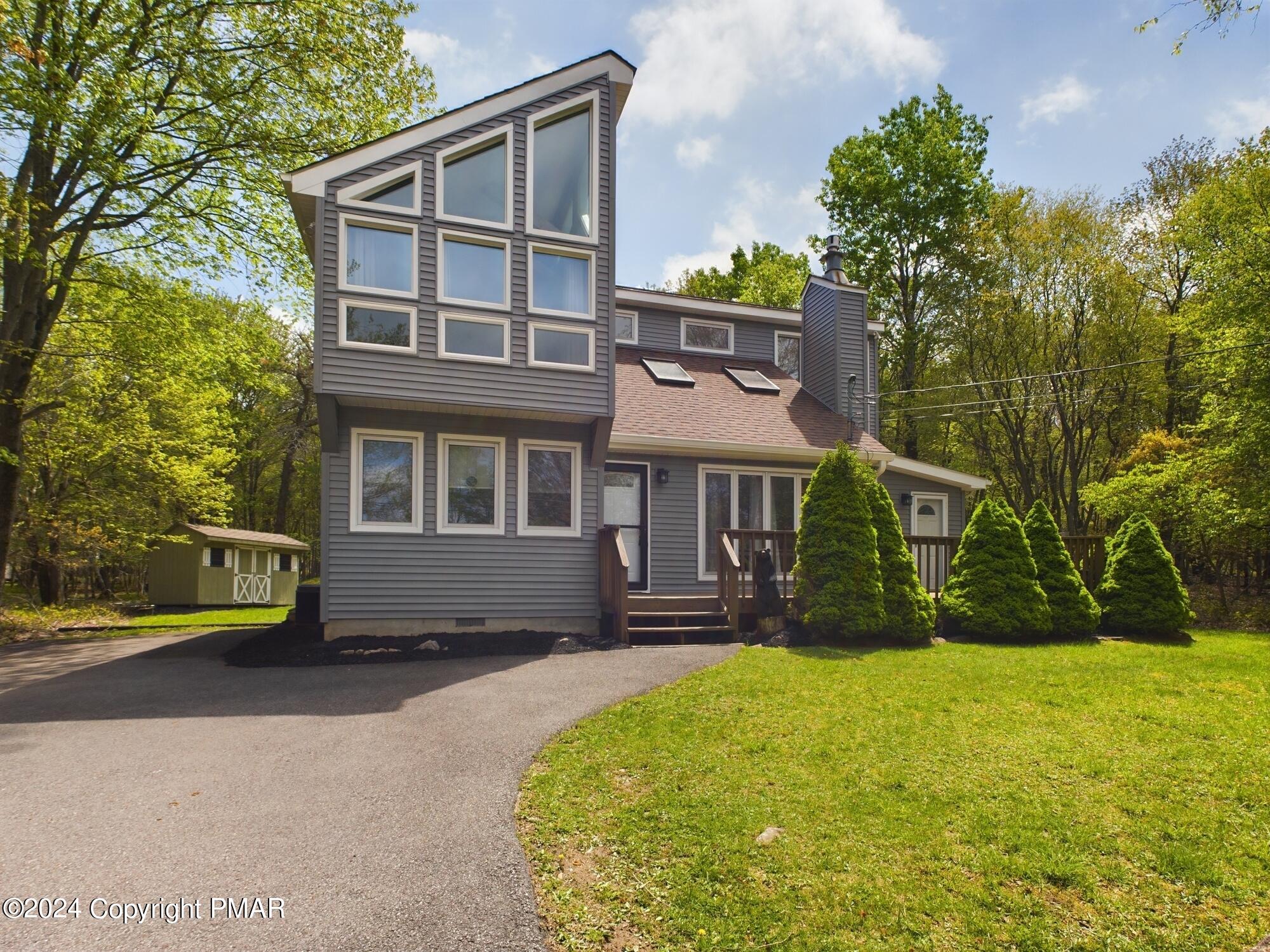 front view of a house with a yard