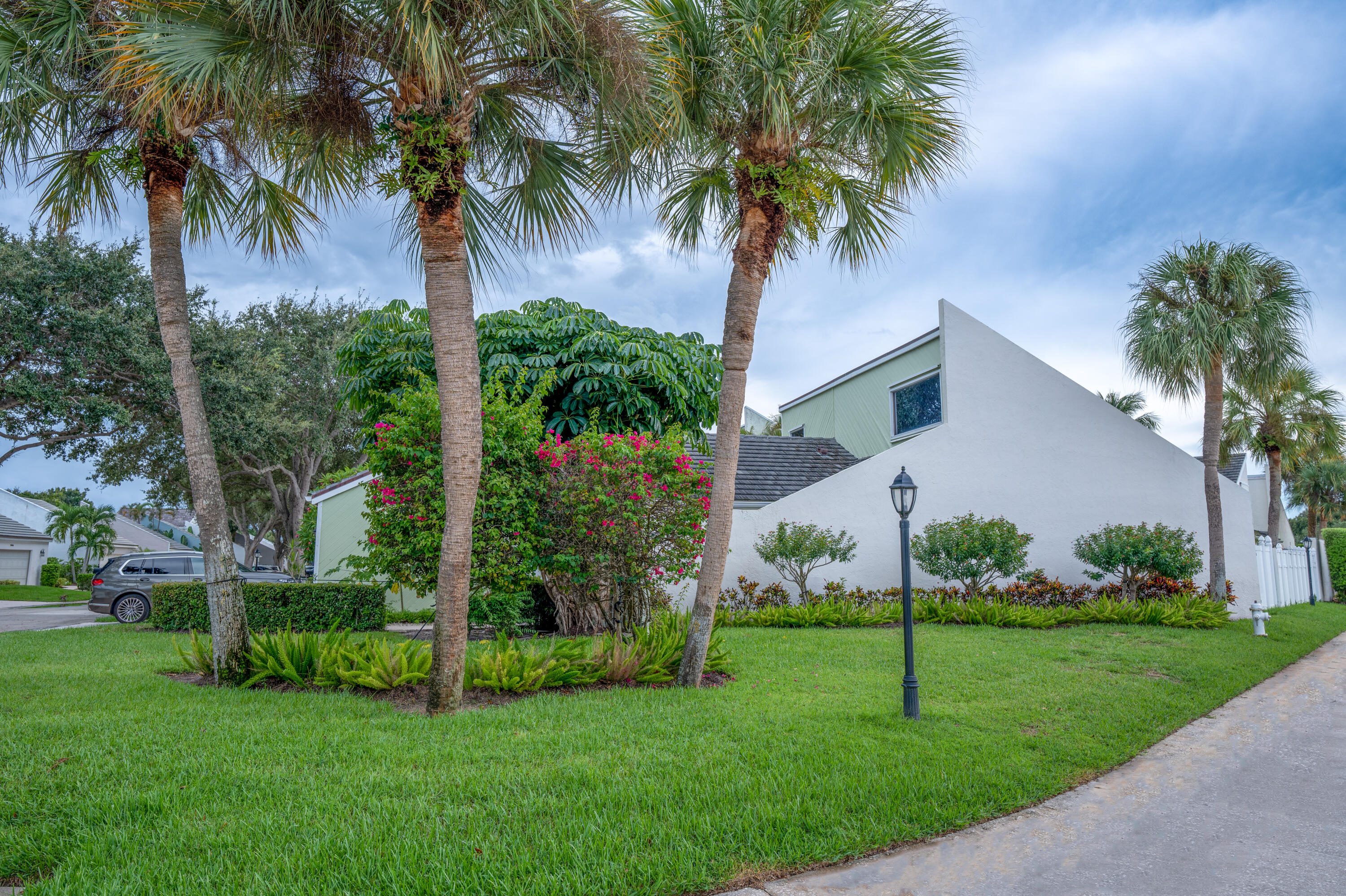 a view of a house with a palm trees