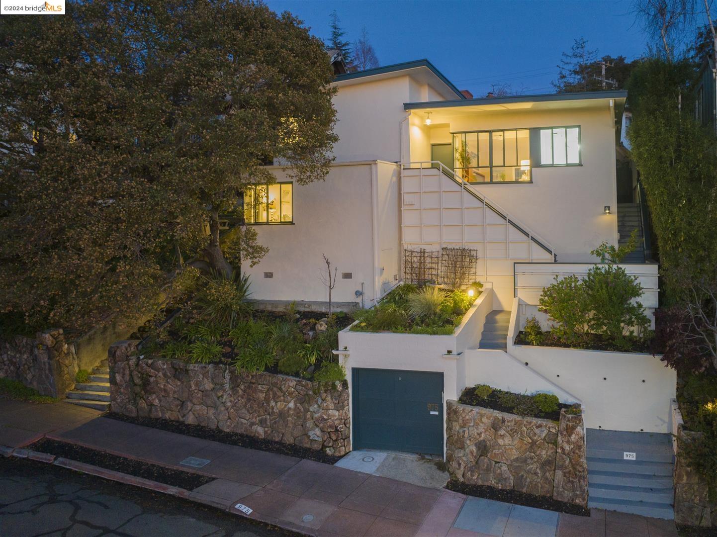 a view of a house with a yard and tree s