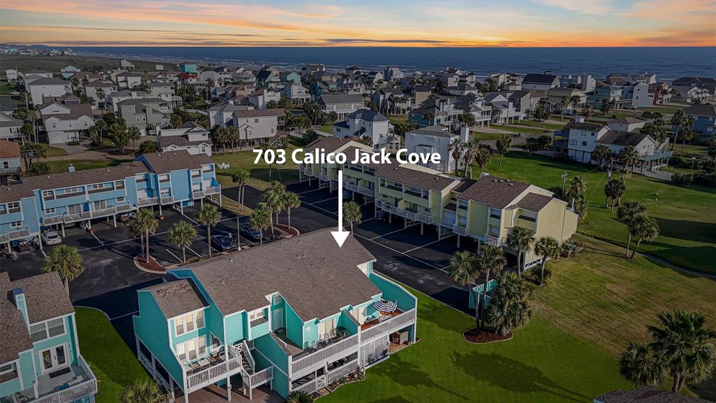 End-unit townhome in a vibrant coastal community, just steps from green spaces and close to the beach, offering serene surroundings and easy access to outdoor activities.