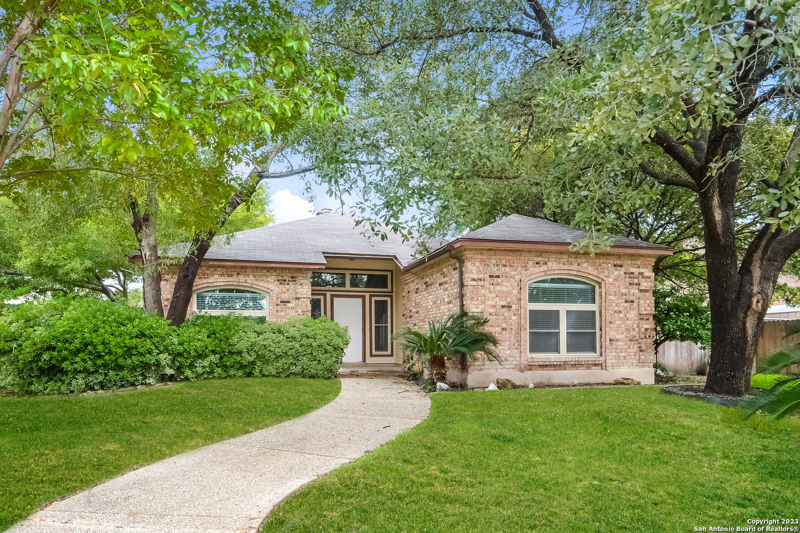 a front view of a house with a yard