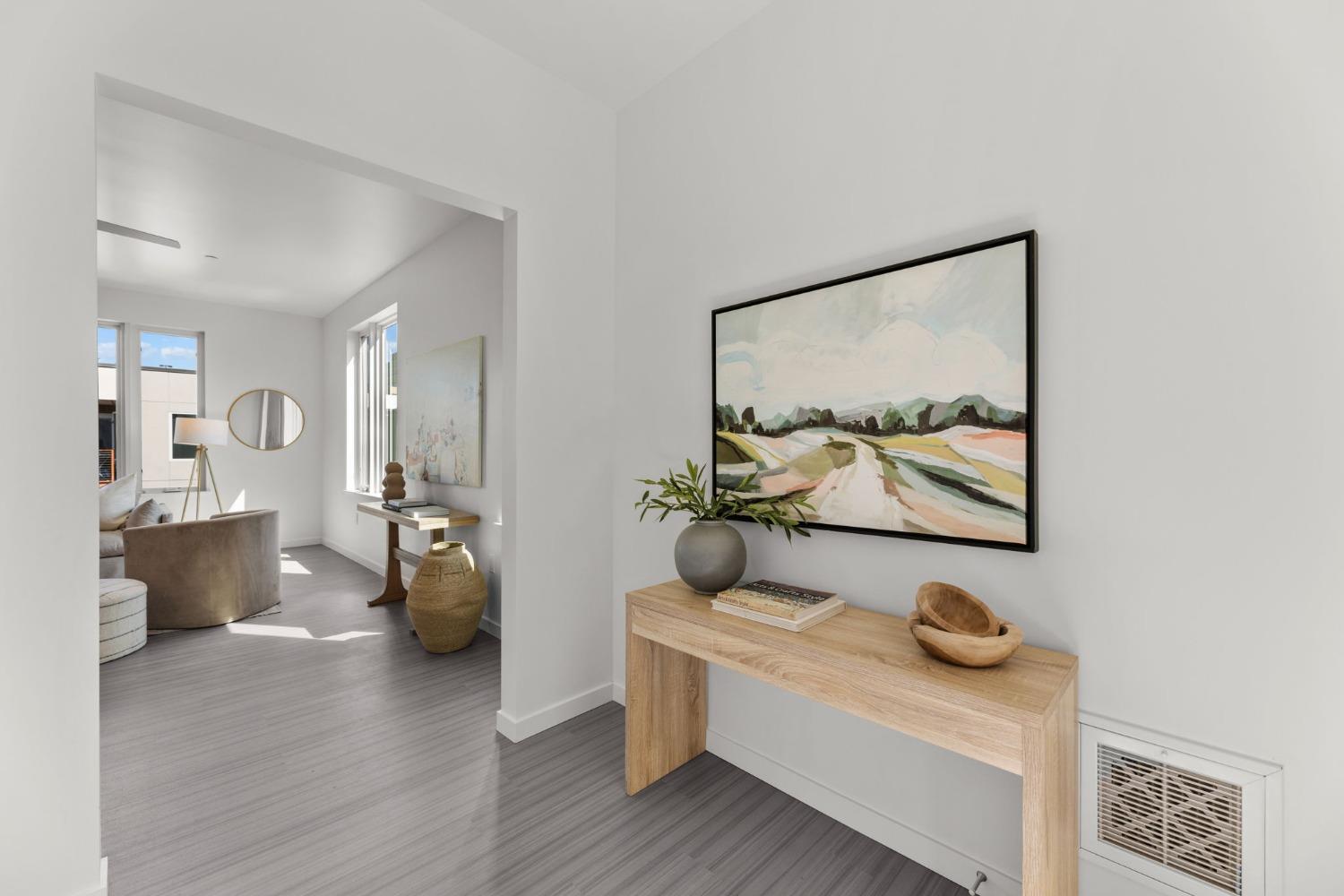 a living room with furniture and view of bathroom