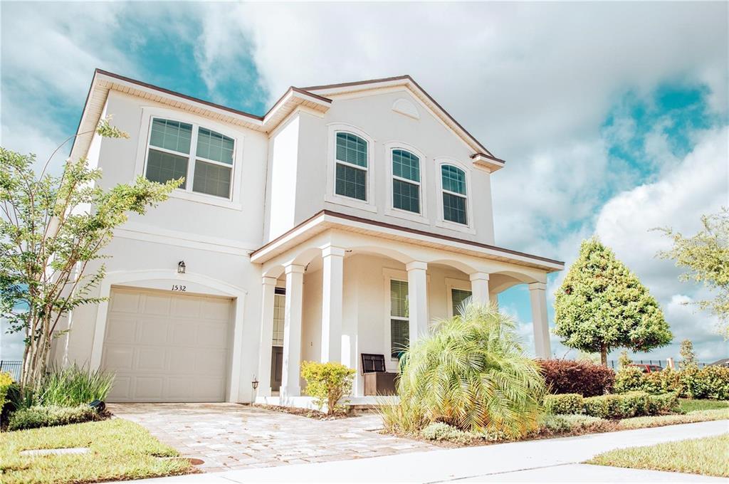 a front view of a house with a yard