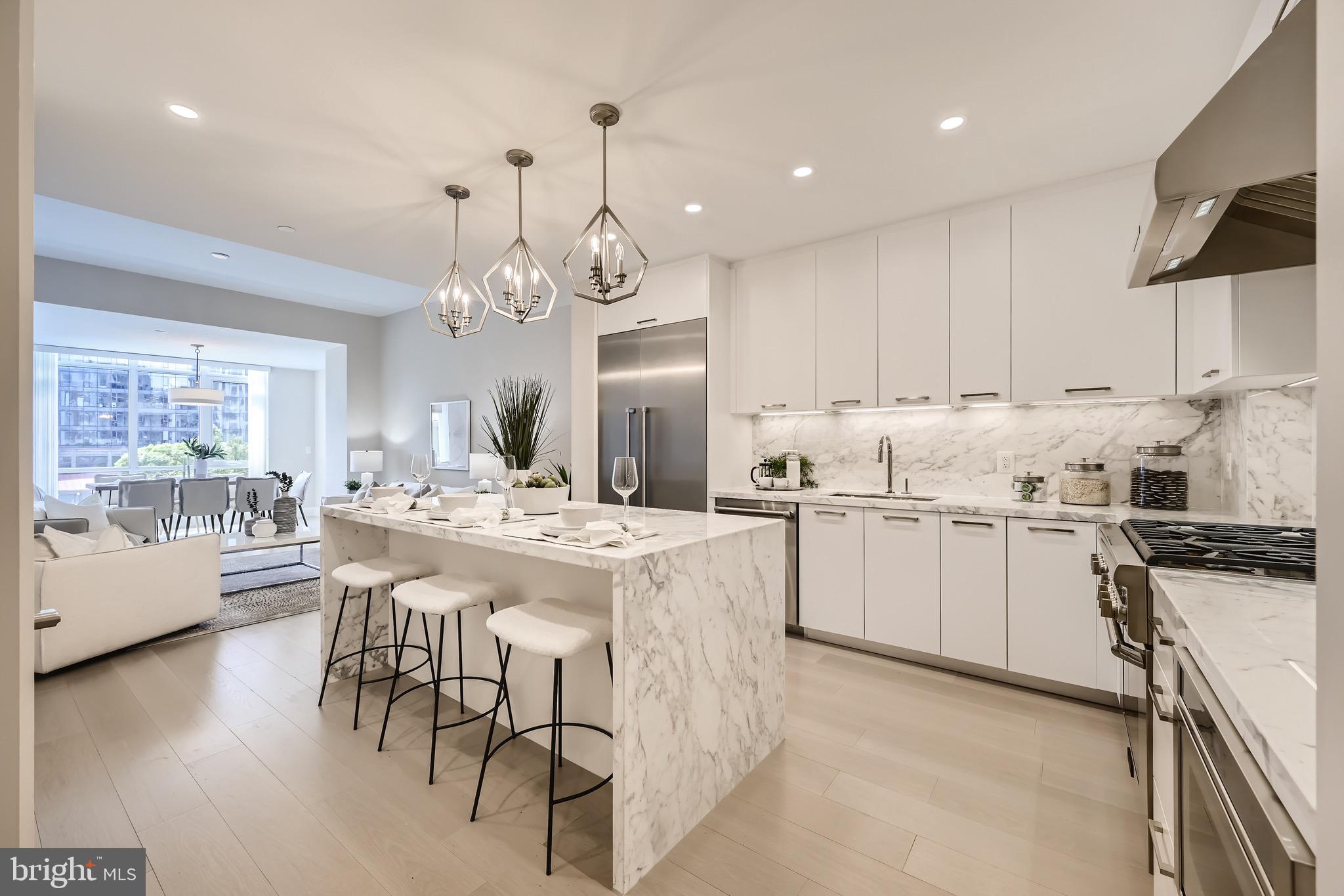 a kitchen with cabinets a sink and appliances