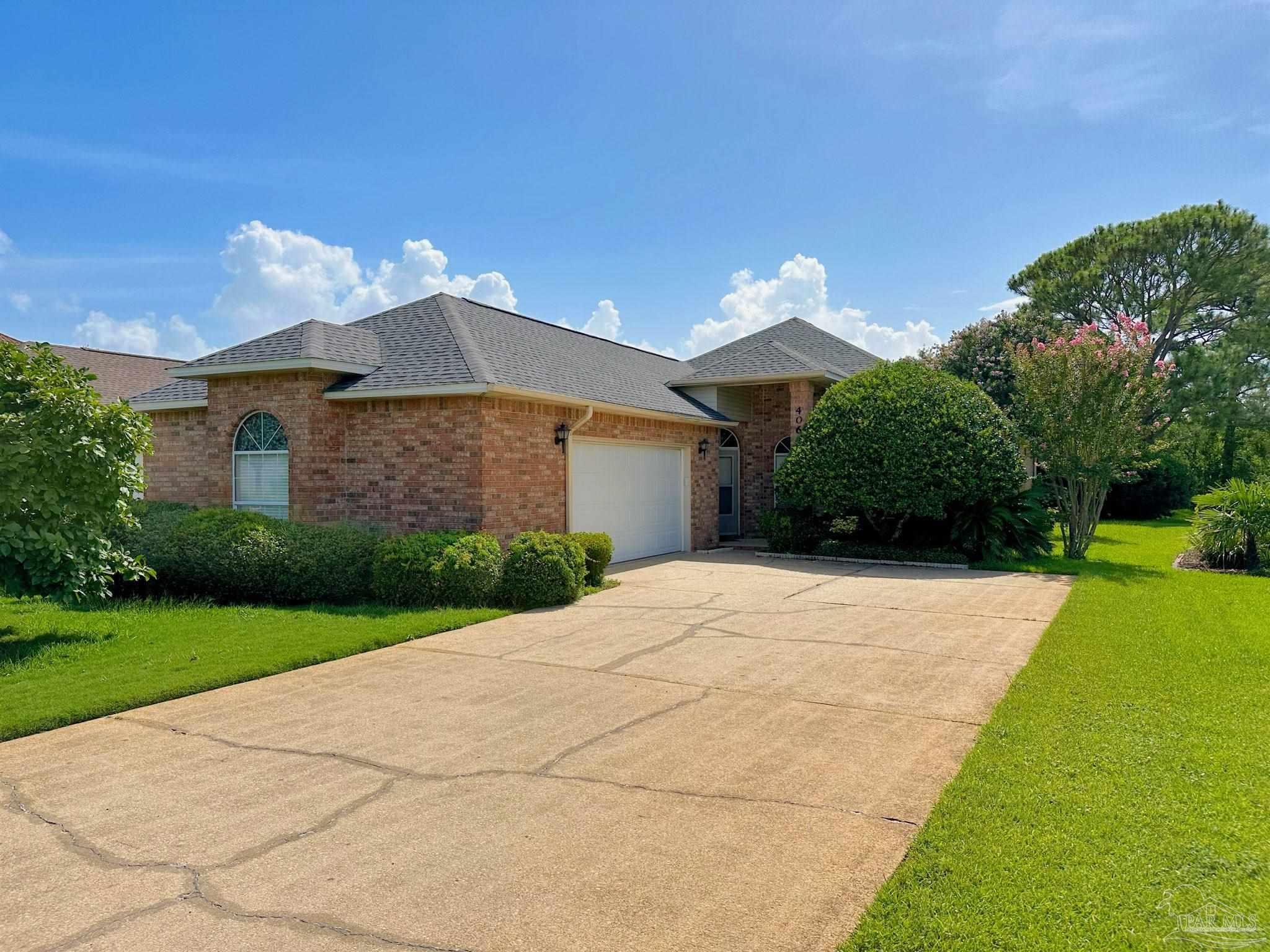 a front view of a house with yard