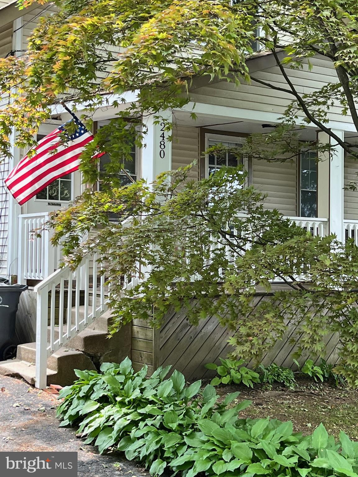 a balcony with yard and outdoor seating