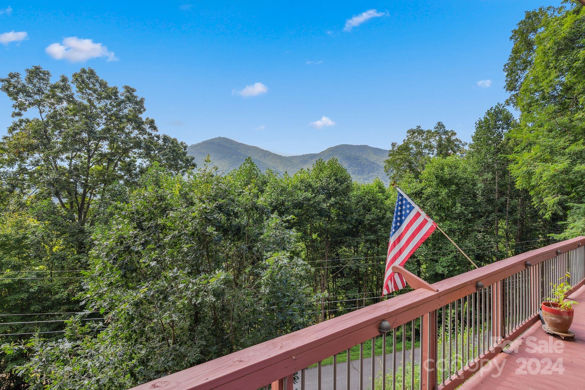 a view of a balcony with an outdoor space