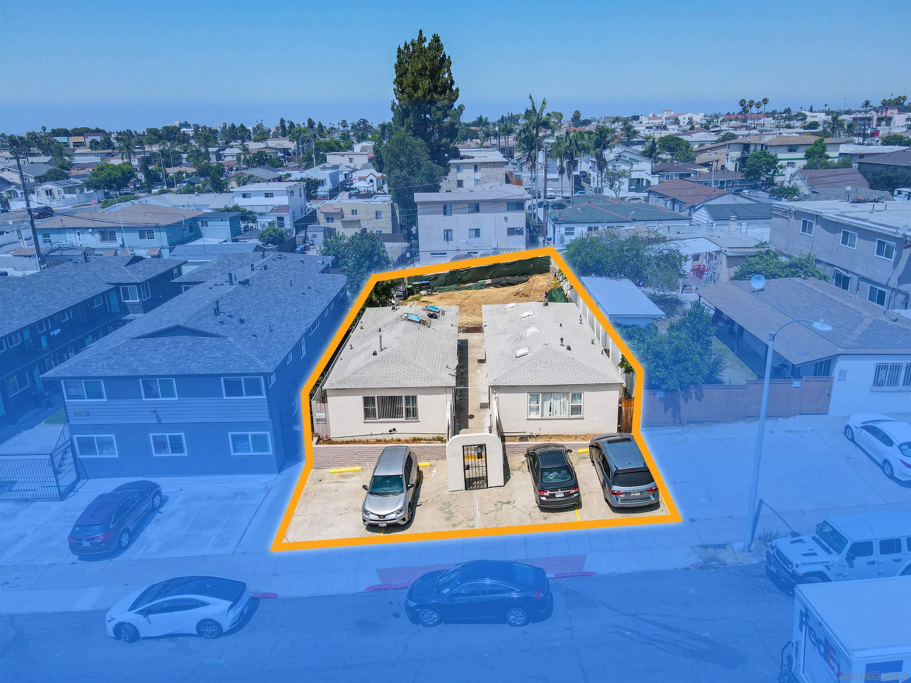 an aerial view of a house with a swimming pool