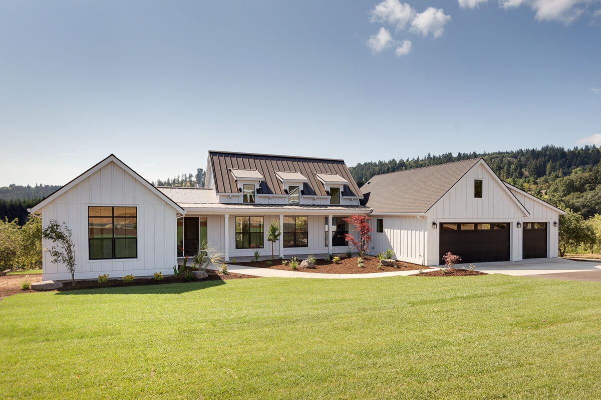 a front view of a house with swimming pool having outdoor seating