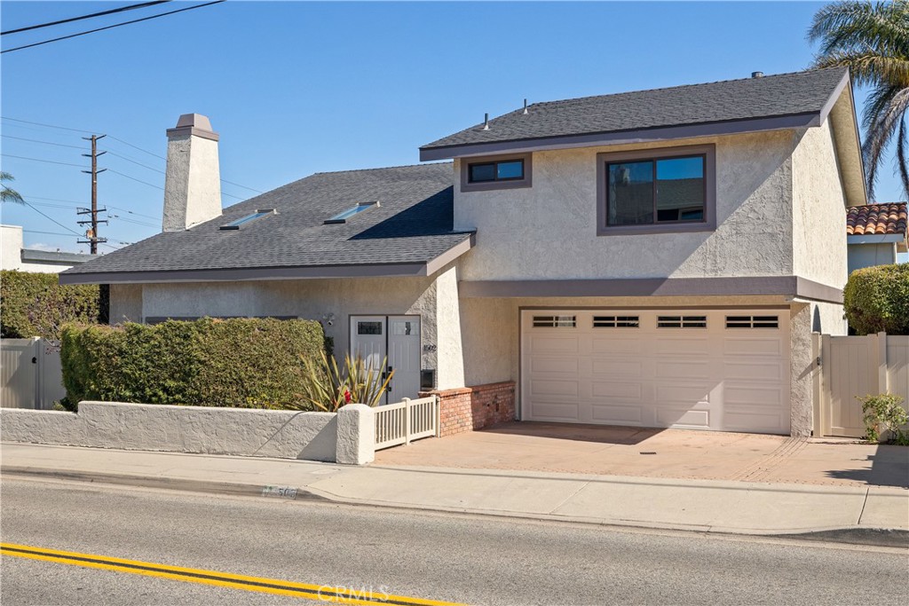 a front view of a house with a garage