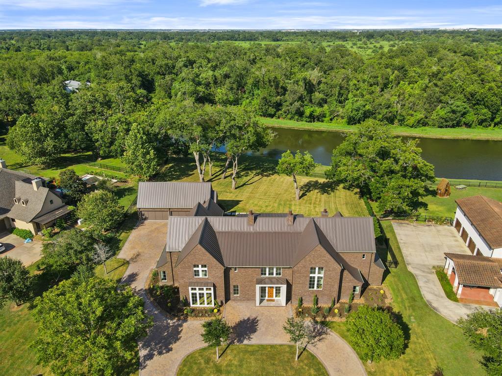 Luxury Custom Estate nestled on a private waterfront acreage lot.