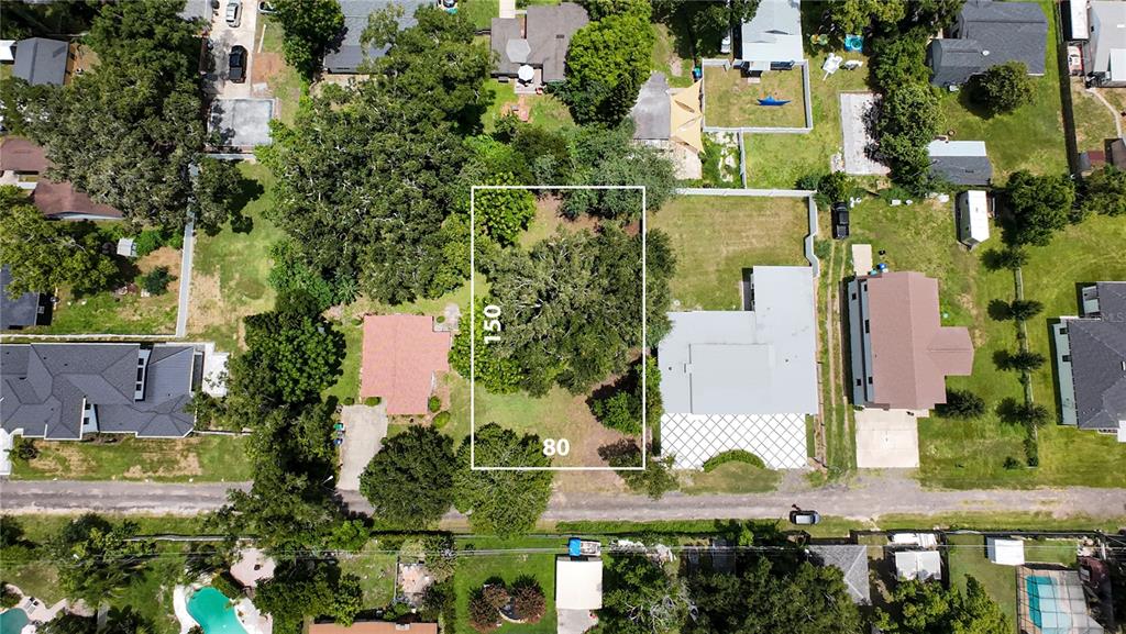 an aerial view of multiple houses with yard