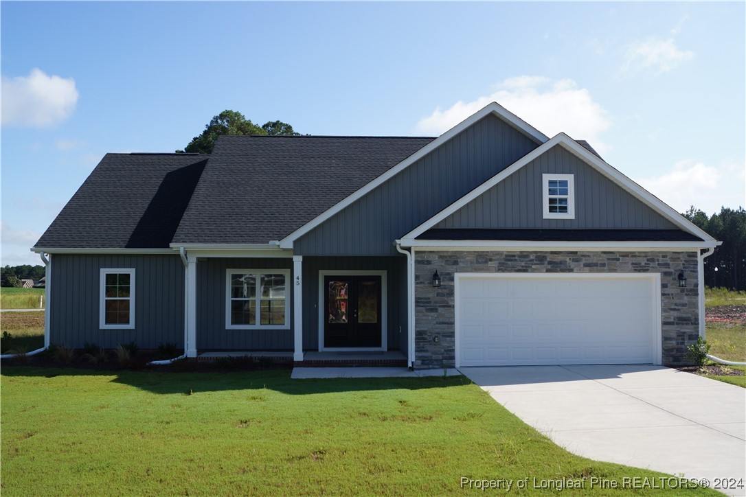 a front view of a house with yard