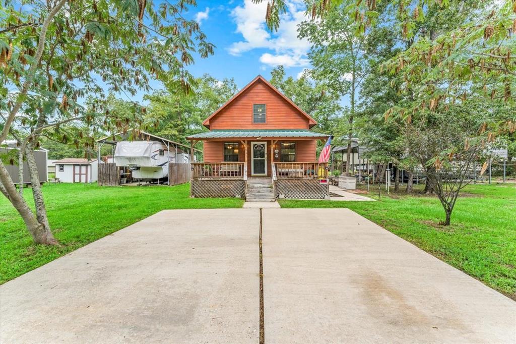 a view of front of house with a yard