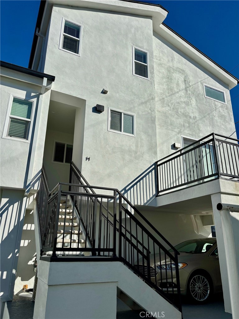 a view of balcony with wooden floor