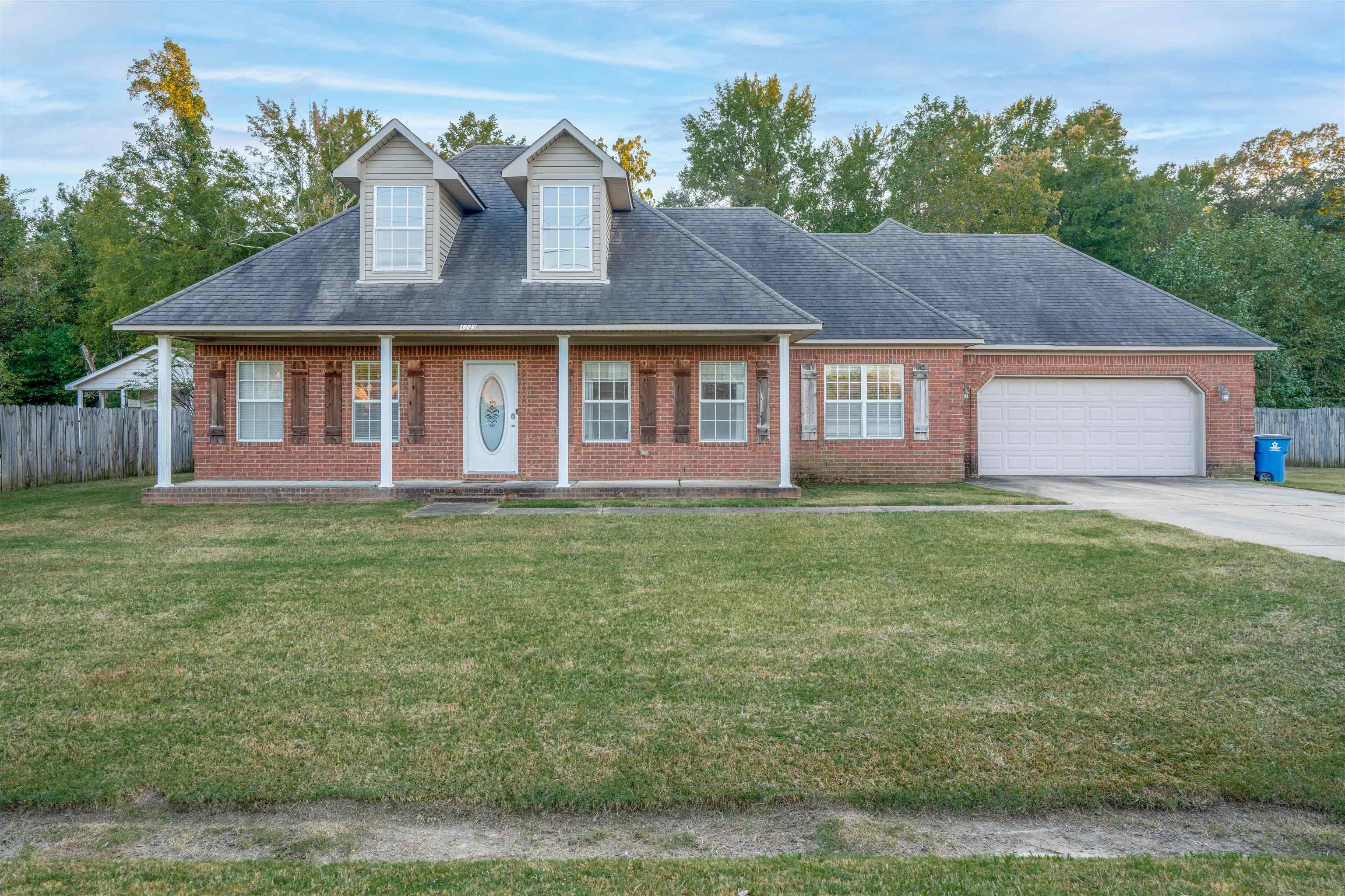 front view of a house with a yard