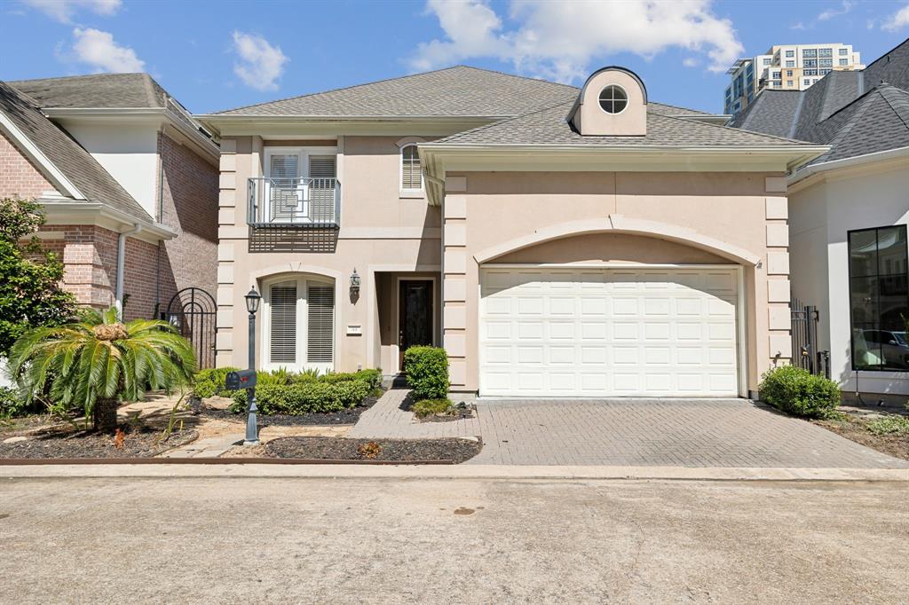 Welcome home to 44 Wynden Oaks in the controlled access community of Wynden Oaks Estates in the Tanglewood Area! The home’s elegant stucco exterior is framed by mature landscaping, offering excellent curb appeal. Manicured hedges and a low maintenance ground cover enhance the inviting, classic look of this Tanglewood-area residence.